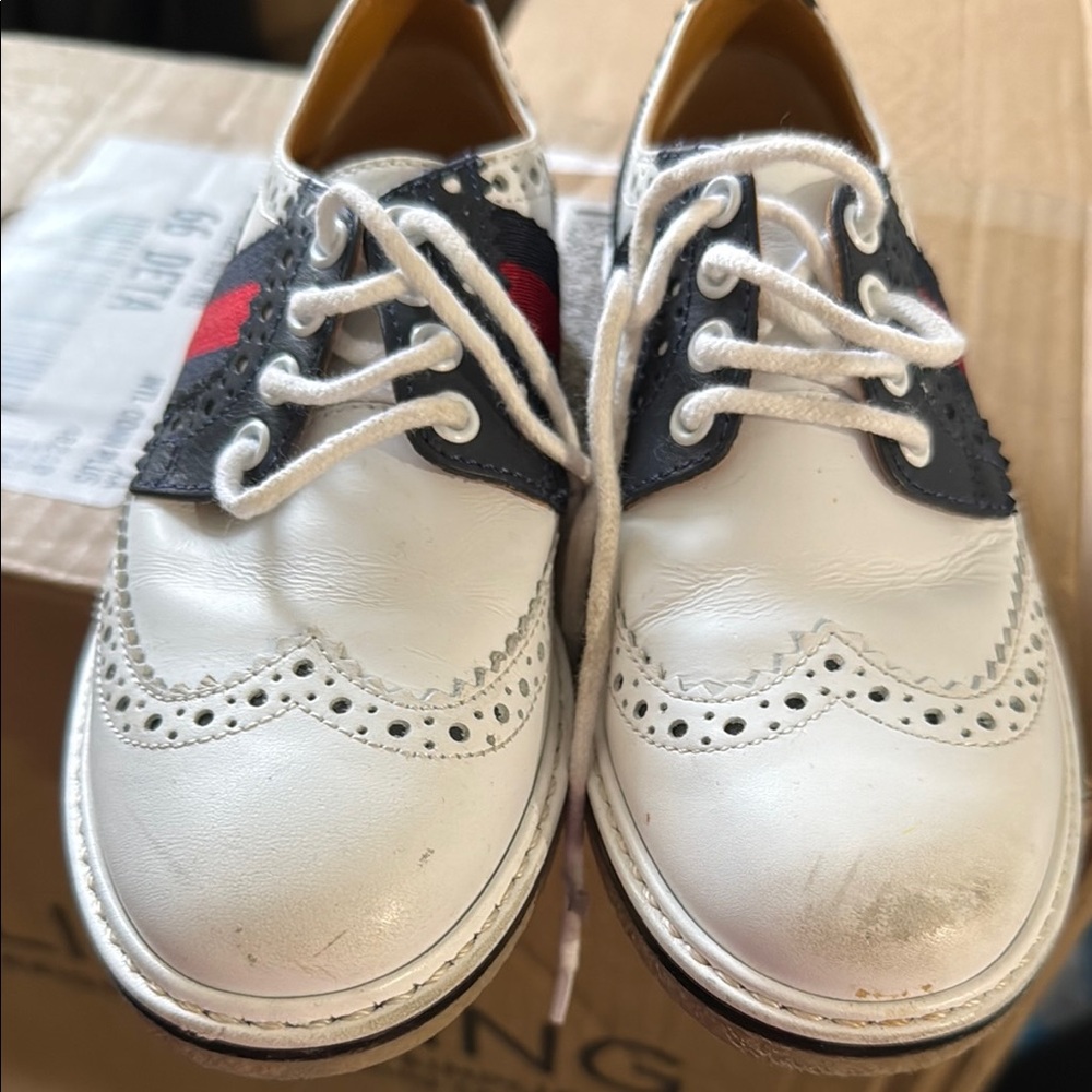 White and Black Wingtip Shoes with Red Stripe